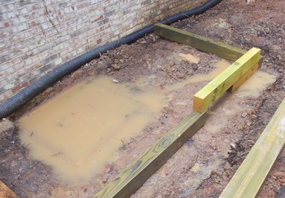 Looks like we'll be raising the height of the new poured concrete slab for the AC, too.